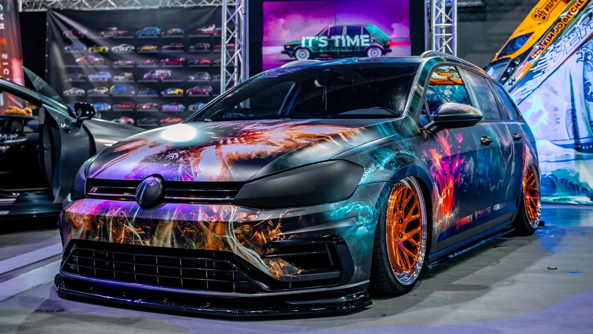 VW Golf R dark custom livery with orange wheels by Wrap My Ride